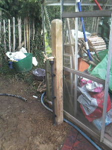 Outside tap for greenhouse fed from rainwater storage tank